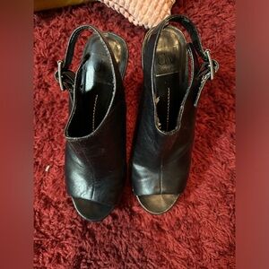 Preowned black leather platform clogs with buckle fastened in size 7M